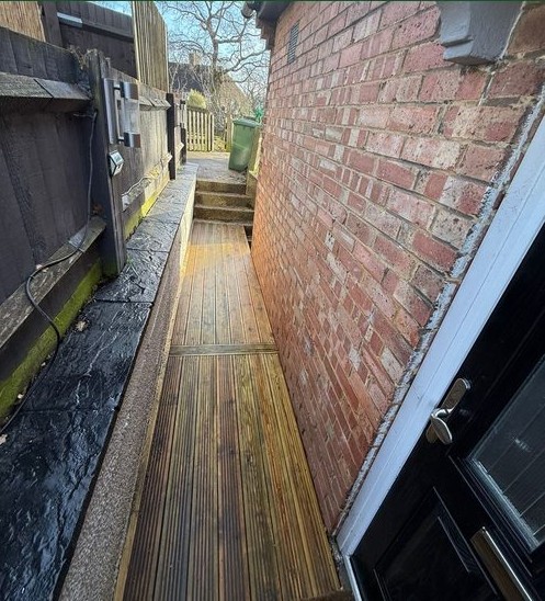 Decked side passage after pressure washing by The Wright Exteriors