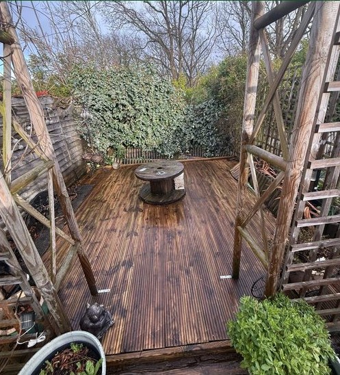 Garden decking after pressure washing by The Wright Exteriors