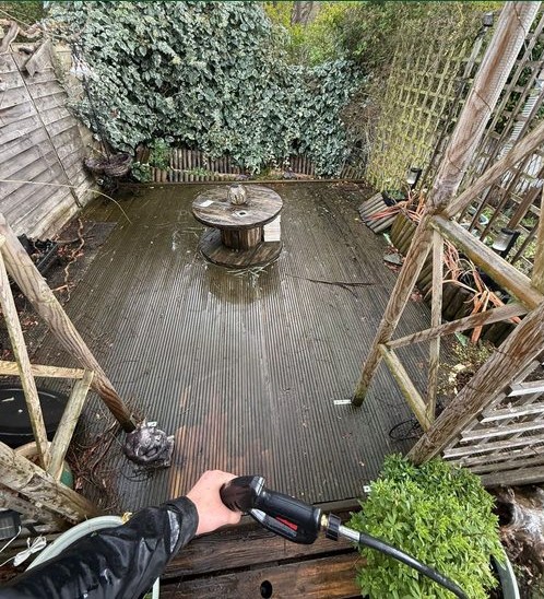 Garden decking before pressure washing