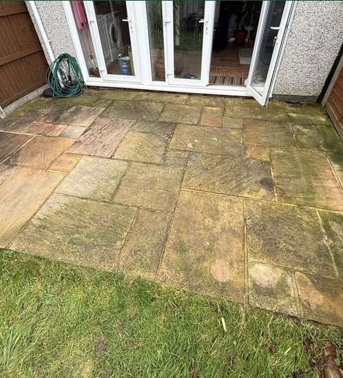 Sandstone patio before pressure washing