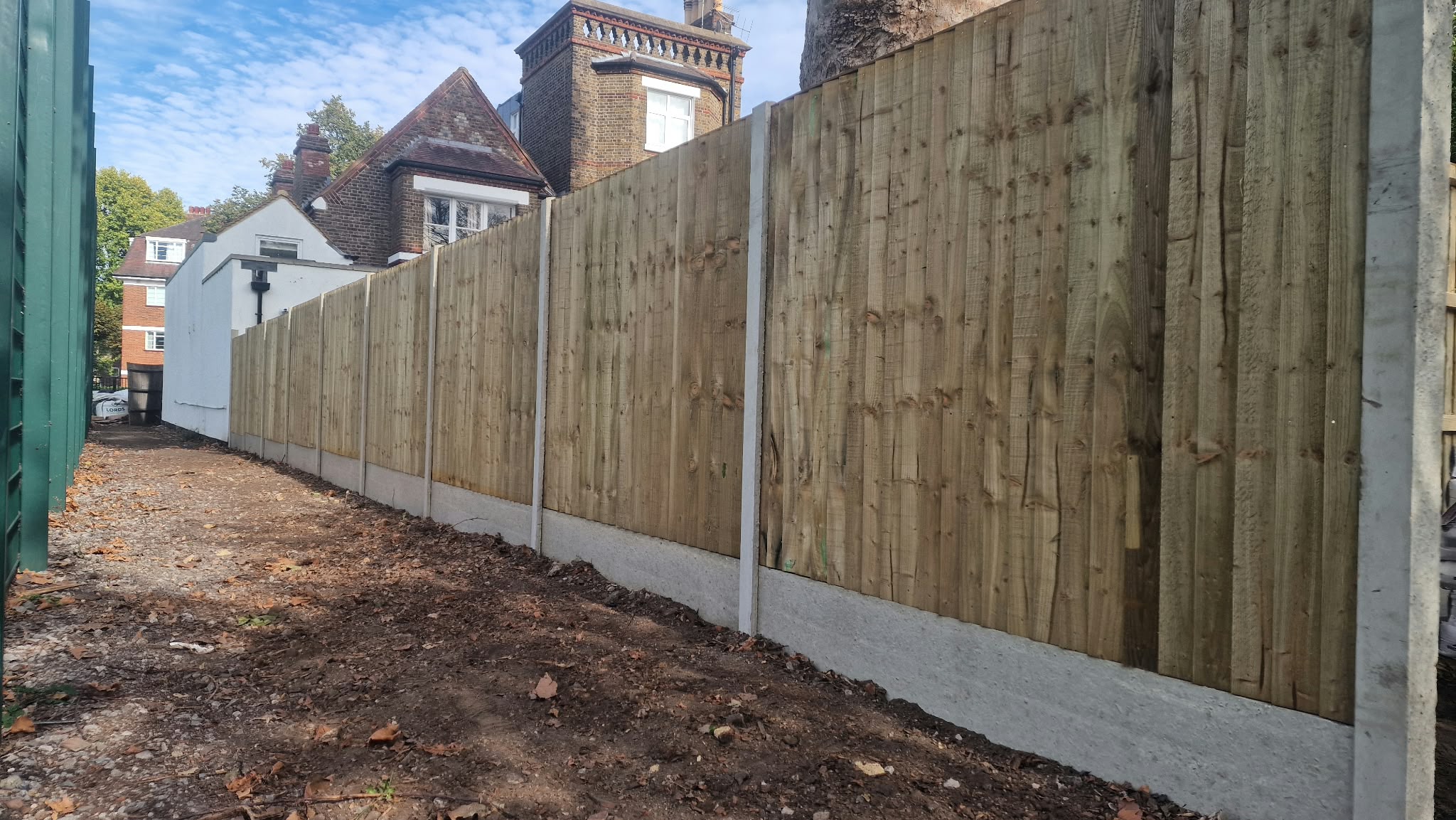 Close board fence run installed by The Wright Exteriors
