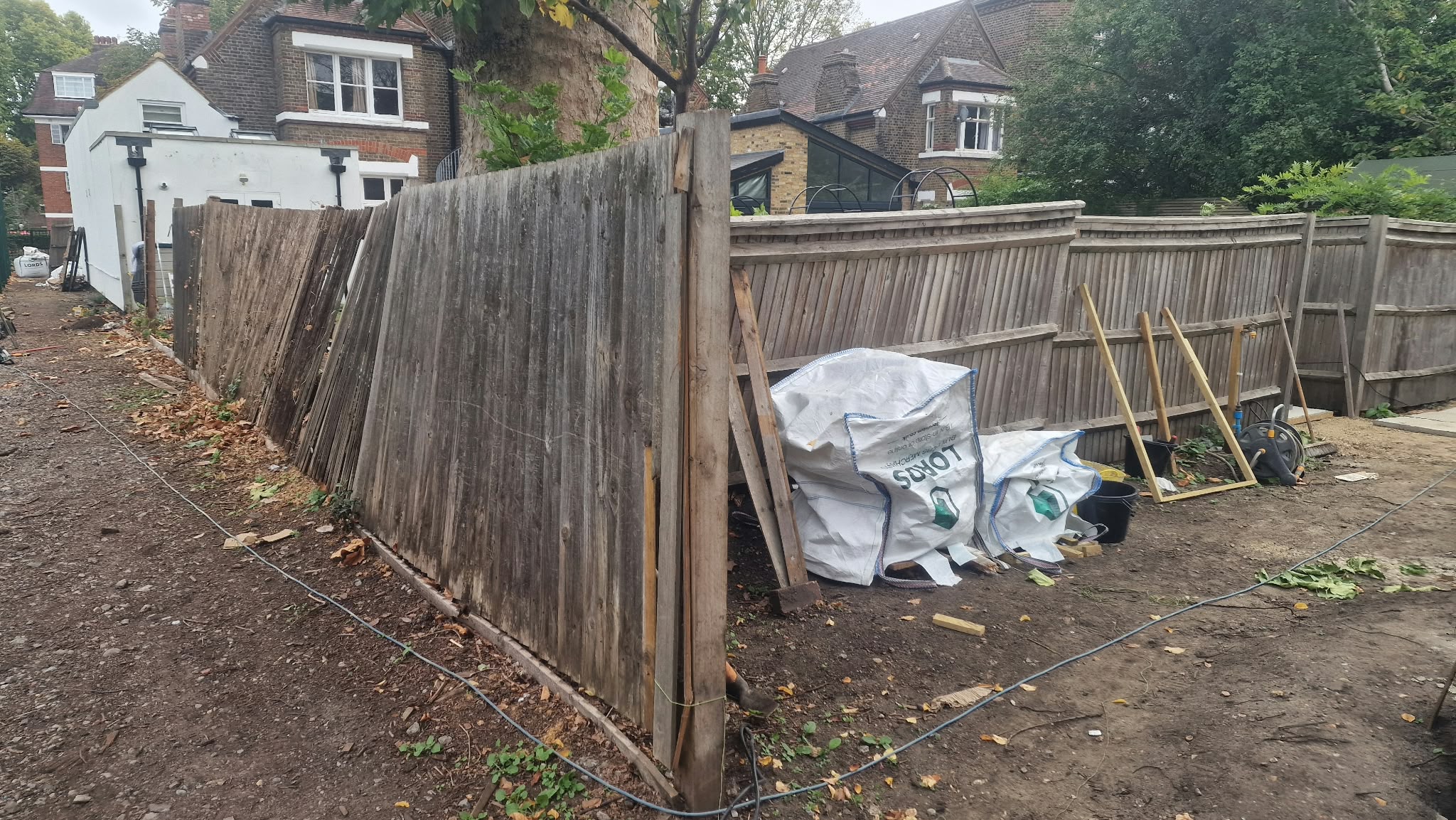 Old leaning fence before close board replacement
