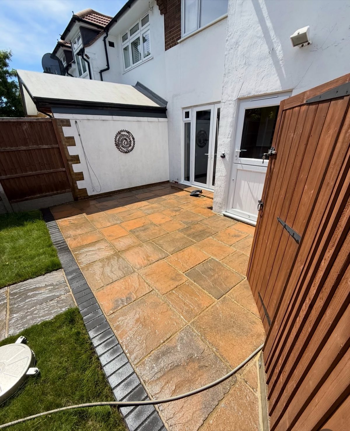 Freshly pressure washed garden patio