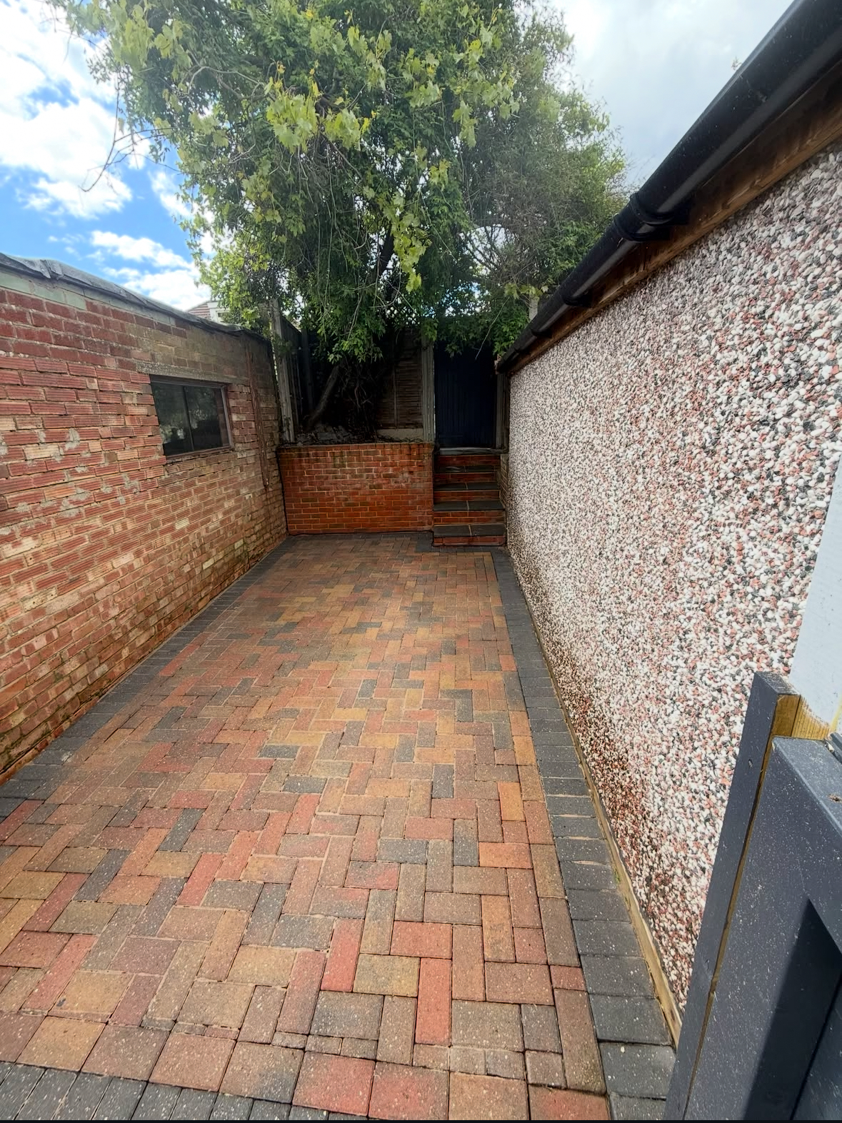 Side passage patio after pressure washing